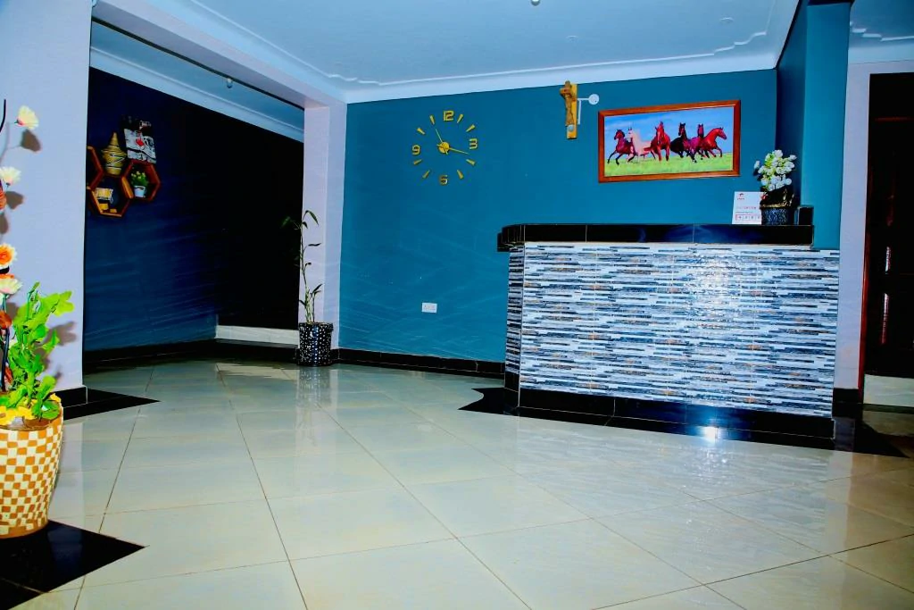 Hotel lobby seating area at Westway Luxury Suites