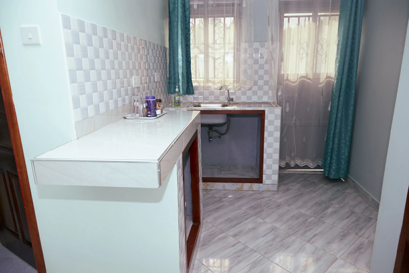 Long stay room with kitchenette at Westway Luxury Suites